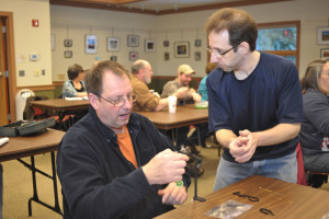 Scott Cesari (R) provides some personized help during a 2015 fly-tying class. Cesari will once again conduct fly-tying classes for the Brodhead Chapter of Trout Unlimited starting January 6, 2016.